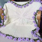 Coperta con bouquet di fiori all'uncinetto