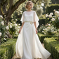 Set con top con maniche a mantella fluide e pantaloni avvolgenti