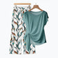 🌿 OFFERTA LIMITATA -50%! ✨ Completo da donna a due pezzi – Top con fiocco laterale e pantaloni con motivo botanico, tessuto traspirante di alta qualità · Azzurro e verde chiaro · S–5XL (EU34-54) 💐