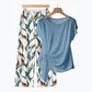 🌿 OFFERTA LIMITATA -50%! ✨ Completo da donna a due pezzi – Top con fiocco laterale e pantaloni con motivo botanico, tessuto traspirante di alta qualità · Azzurro e verde chiaro · S–5XL (EU34-54) 💐