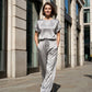 Set composto da un elegante top e un paio di pantaloni a gamba larga da donna