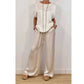 Set composto da un elegante top e un paio di pantaloni a gamba larga da donna