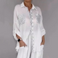 Set composto da una camicetta da donna con paillettes e un paio di pantaloni larghi