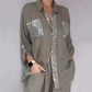 Set composto da una camicetta da donna con paillettes e un paio di pantaloni larghi