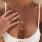 Collier multicouche élégant avec pendentif délicat