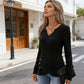 Top in maglia da donna con scollo a V e orlo asimmetrico