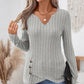 Top in maglia da donna con scollo a V e orlo asimmetrico