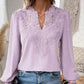 Top elegante da donna a maniche lunghe