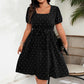 Abito a pois da donna taglie forti