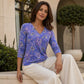 Top da donna elegante con stampa floreale e scollo a V