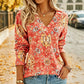 Top da donna elegante con stampa floreale e scollo a V