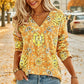 Top da donna elegante con stampa floreale e scollo a V