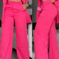 Completo da donna elegante con blazer a revers dentellato e pantaloni a gamba larga
